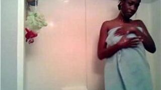 Ebony girl takes a hot and foamy shower - porn video